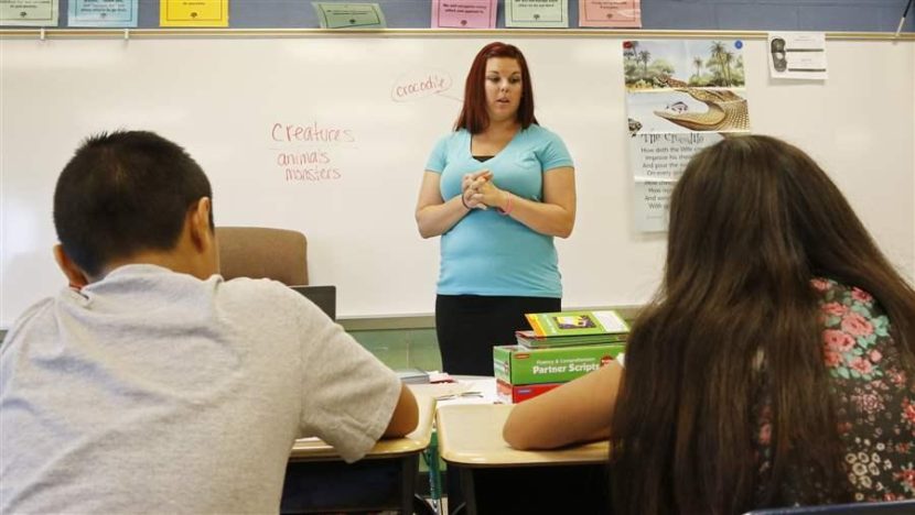 Kelci Gouge teaches third-graders at a summer reading academy in Oklahoma City. Oklahoma is one of several states grappling with a severe teacher shortage. AP