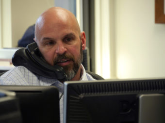Jim Parise, director of investments, at his desk in the Alaska Permanent Fund Corp., March 14, 2016. (Photo by Skip Gray/360 North)