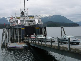 Drivers move their cars and trucks off the ferry Fairweather at the Angoon terminal in 2010. (Photo by Ed Schoenfeld/CoastAlaska News)