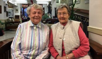 Betty Decicco, left, and Fredi Young became fast friends while volunteering in the gift shop and living at the Sitka Pioneer Home year-round. (Photo by Emily Kwong/KCAW)