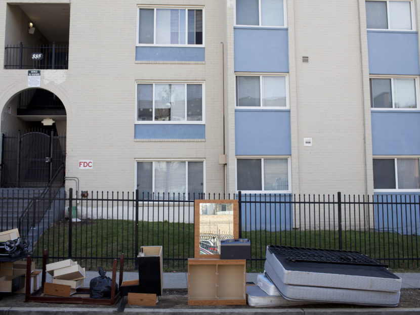 Personal belongings and furniture piled up outside Limes' apartment complex during one of two evictions that took place on March 3. Brandon Chew/NPR