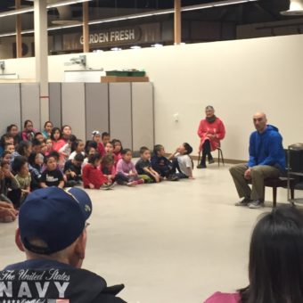 Principal Sam Crow addresses students and their families at the grand opening ceremony at Kipusvik. (Photo by Charles Enoch/KYUK)