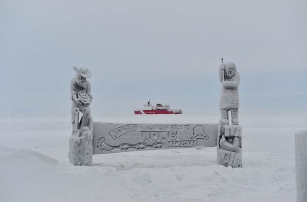 The Coast Guard Cutter Healy breaks ice near the city of Nome. (Public Domain photo by Chief Petty Officer Kip Wadlow/U.S. Coast Guard)