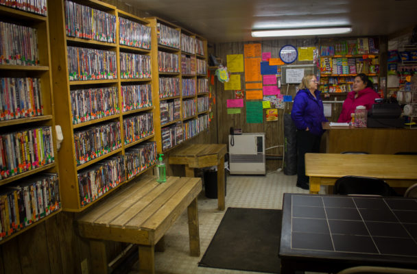 Corinne Trish catches up with Crystal Dewey before the shop opens for the evening. (Photo by Emily Russell/KNOM)
