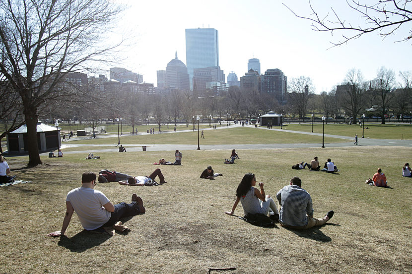 People in Boston enjoyed a late winter heat wave this past March. In much of the U.S., climate change is causing winters to warm faster than summers. Suzanne Kreiter/Boston Globe via Getty Images