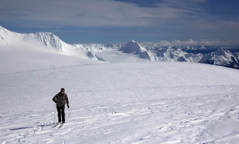 Chris Hanna on the Harding Icefield Friday, April 8th with Kenai Fjords National Park in the background, looking towards Seward. (Photo courtesy of Jenny Neyman)