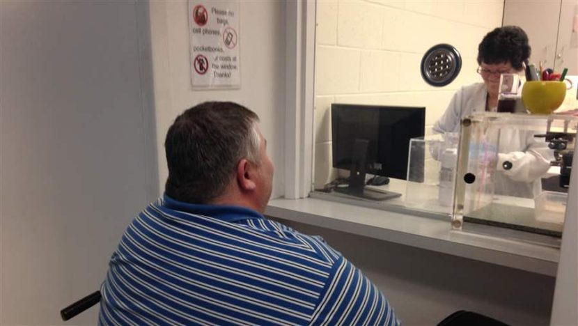 A patient gets a dose of the anti-addiction medicine buprenorphine at the Broadway Center for Addiction in Baltimore, whose treatment methods for opioid addiction are viewed as a model for other clinics. (Photo courtesy of Pew Charitable Trusts)