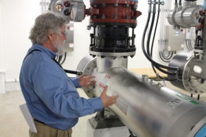 “This is where the action takes place…”. Weatherman points out the three UV reactors in the plant.