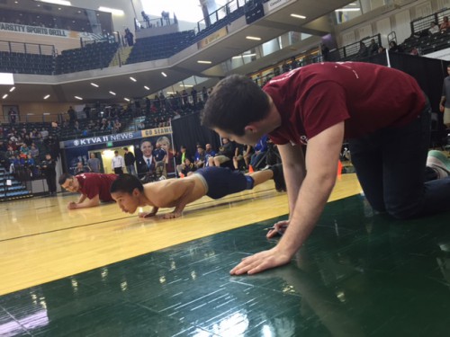 Jeremy Roberts set a personal record on the final day of NYO. During the male seal hop event he traveled 128 inches. (Photo by Emily Kwong/KCAW)