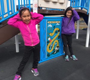 Chloe Lewis plays with her friend on the school playground in Kwigillingok. (Photo by Anne Hillman/KSKA)