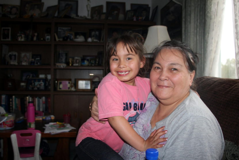 Nola Angasan with her adopted granddaughter, "Little" Nola. (Photo by Hannah Colton/KDLG)