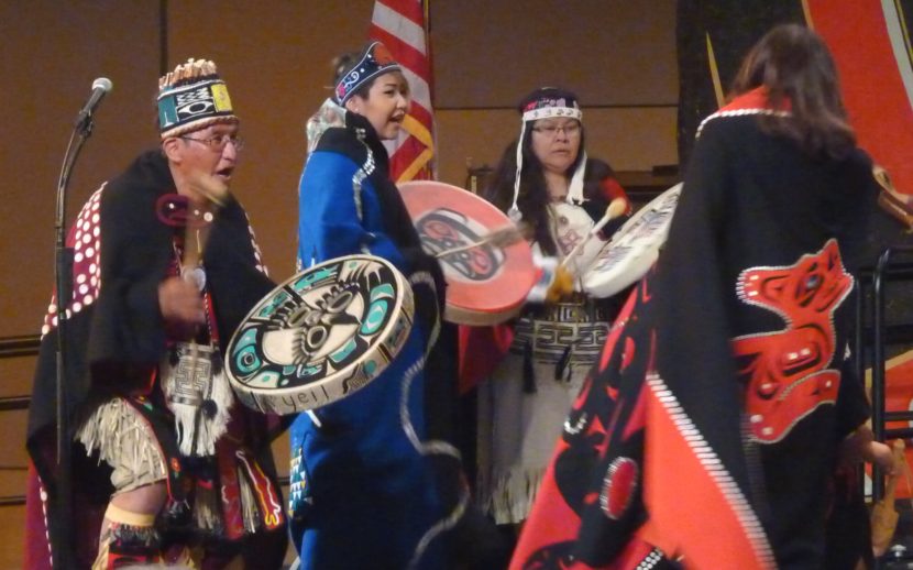 Taku Kwaan Dance Leader Wayne Carlick and others drum as more than 30 people take the stage during Celebration 2016 (Photo by Ed Schoenfeld/CoastAlaska News) 