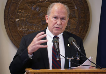 Gov. Bill Walker talks to reporters at his temporary offices in Juneau, June 15, 2016. (Photo by Jeremy Hsieh/KTOO)