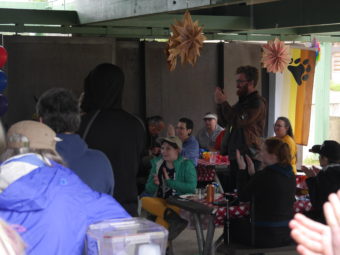 Audience applauds Jesse Kiehl for proposing anti-discrimination law. (Photo by Quinton Chandler/KTOO) Sunday, June 12, 2016. Savikko Park. Sandy Beach.
