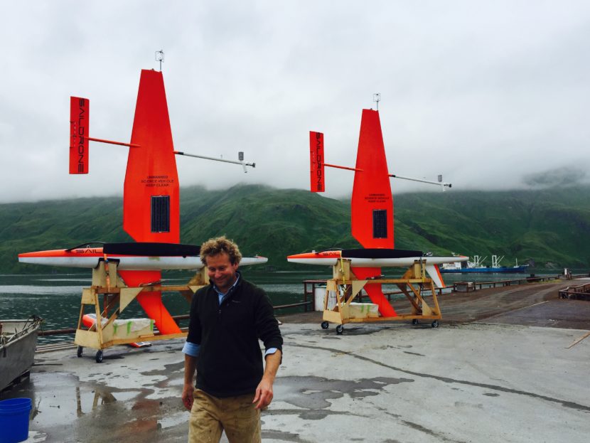Saildrones Inc. CEO Richard Jenkins turns his back (unwisely?) on two of his creations in Unalaska. Photo: John Ryan/KUCB.