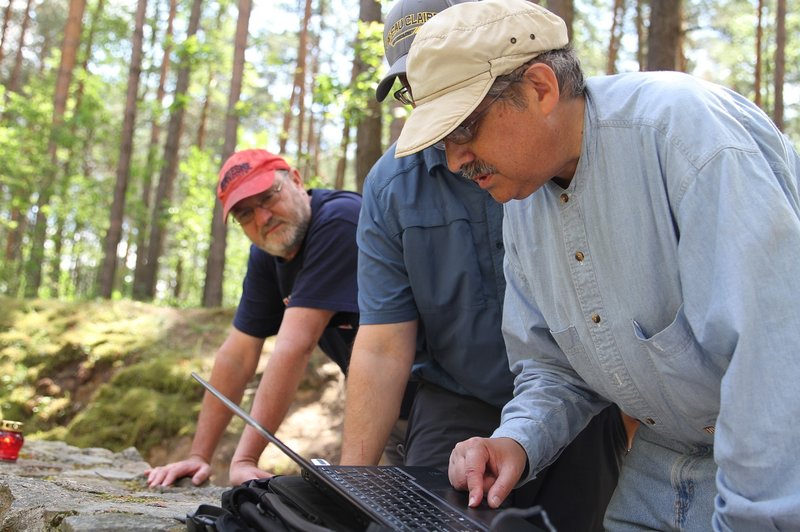 Richard Freund, University of Hartford (front); Harry Jol, University of Wisconsin, Eau Claire (middle); and Philip Reeder, Duquesne University (back), discuss where the next round of work will be conducted. Ezra Wolfinger for Nova