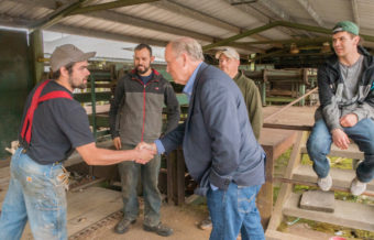 Gov. Bill Walker shakes hands with workers inside the Viking Lumber mill July 16 in Klawock. (Photo courtesy the governor's office)