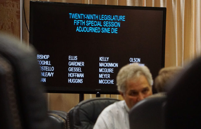 Sens. Pete Kelly, R-Fairbanks, and Charlie Huggins, R-Wasilla, linger after the Senate adjourned sine die, July 18, 2016. (Photo by Jeremy Hsieh/KTOO)