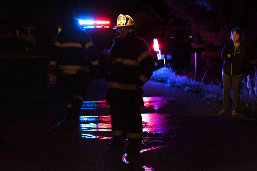 Firefighters work to extinguish a house fire on Cascade Street on July 8, 2016 in Juneau, Alaska.
