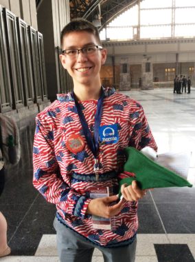 Nathan Sidell of Palmer poses with one of the Robin Hood caps Sanders supporters distributed at the Democratic convention. (Photo by Liz Ruskin/Alaska Public Media)