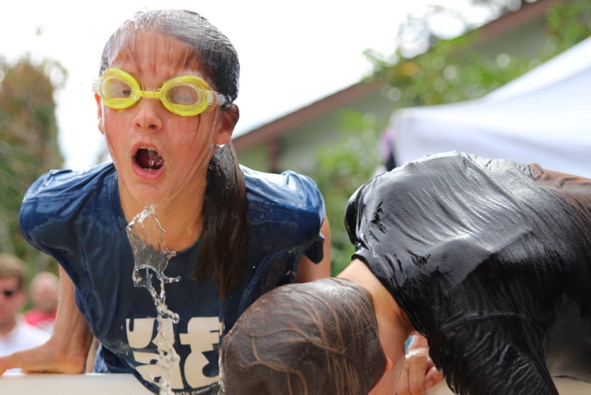 Esther Burdick comes up empty in the Bobbing-for-Fish Heads event during the 2015 festival. She would eventually land her humpy. (KCAW photo/Robert Woolsey).