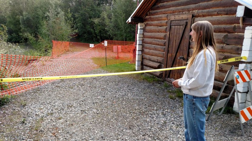 Delta Historical Society President Maureen Gardner says members of the organization and State Parks officials agreed to remove artifacts from the old Telegraph Station living quarters because the Tanana River continues to wash away at the riverbank, threatening the cabin and nearby trails. (Photo by Tim Ellis/KUAC)
