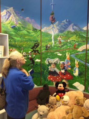 Seckel looks for familiar faces in Jane Terzis and Dan DeRoux's "Children's Storybook Characters." (Photo by Scott Burton/KTOO).