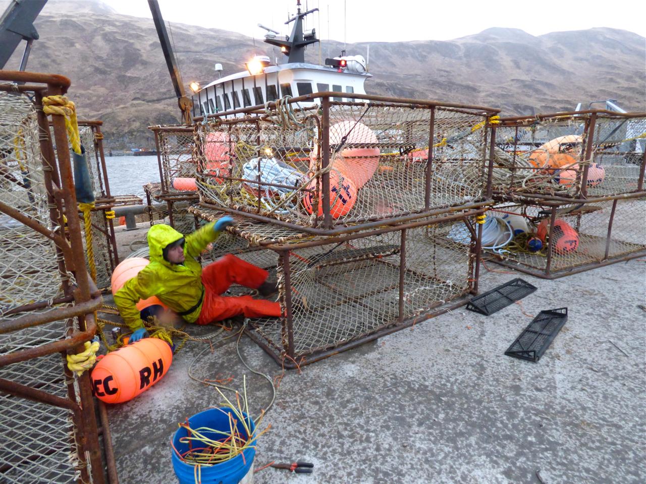 An Unalaska fisherman prepares for tanner crab season. (Photo by KUCB)