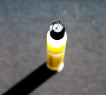 Used EpiPen standing on end.