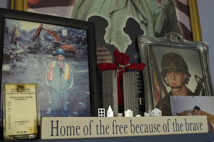 Framed photographs of John Feal (left) working as a first responder in the days before his injury at the World Trade Center, and during his time serving in the 101st Airborne Division. Christopher Cameron /WSHU