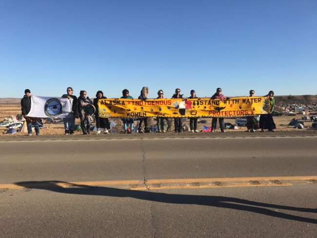 The delegation of indigenous women from Alaska presented a flag from the Chickaloon Tribe and a banner to the Standing Rock Sioux Tribe. (Photo by Amanda Frank)