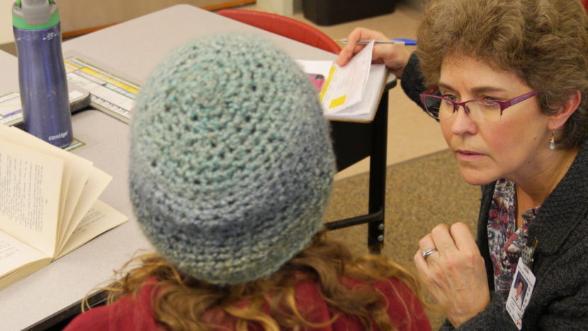 Nurse Luann Powers tries to check a student's blood sugar in a classroom of Auke Bay Elementary, Thursday.