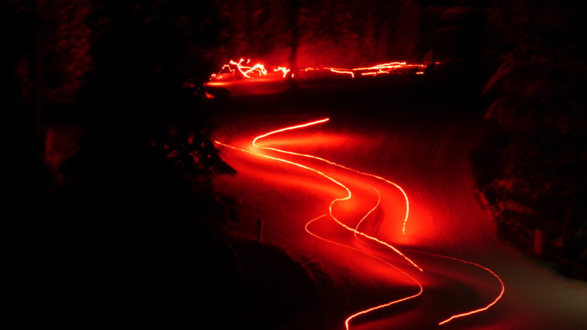 Skiers participate in a torchlight parade down the slopes at the Eaglecrest Ski Area on Dec. 24, 2016. An extended exposure creates the light streaking effect. (Photo by Quinton Chandler/KTOO)