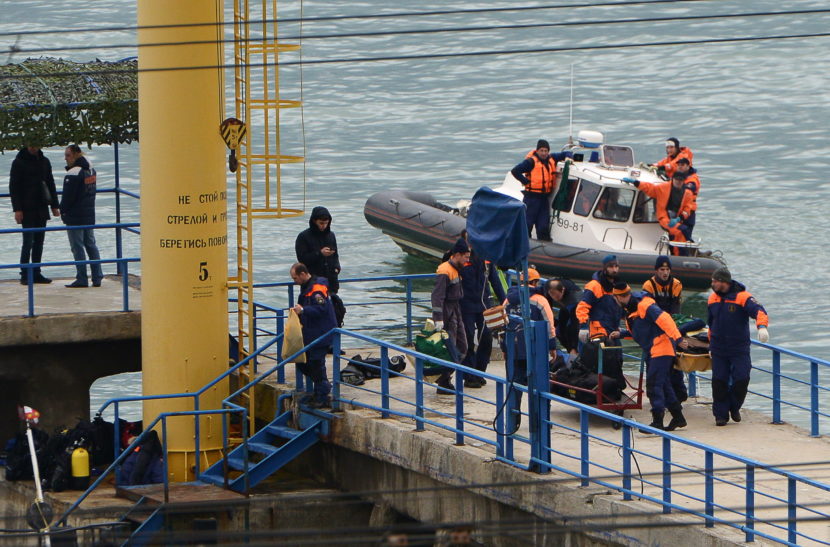 A search and rescue team attends to the crash site of a Russian Defense Ministry plane after the Tupolev Tu-154, with 92 people on board, fell off of radar over the Black Sea early Sunday. Artur Lebedev/Artur Lebedev/TASS