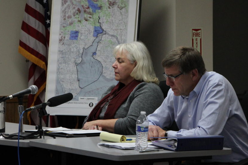 Dillingham Mayor Alice Ruby, seated next to attorney Brooks Chandler, made the case to the LBC that the city provides services to the region and the Nushagak district fishery. The city asked again to annex the Nushagak waters to levy a tax on the fish harvest, which the LBC granted in part. (Photo by KDLG News)