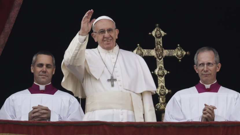 Pope Francis delivered his Christmas day blessing from the main balcony of St. Peter's Basilica at the Vatican Sunday, before a crowd of some 40,000 people. Alessandra Tarantino/AP