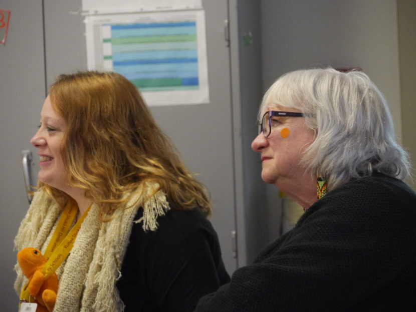 Hoonah City Schools Superintendent PJ Ford Slack, right, sits in on the Orange Frog training, Tuesday, Jan. 10, 2017.