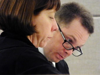 Defense attorney Eve Soutiere and defendant Christopher Strawn look over documents during the start of his homicide trial on Feb. 6, 2017.