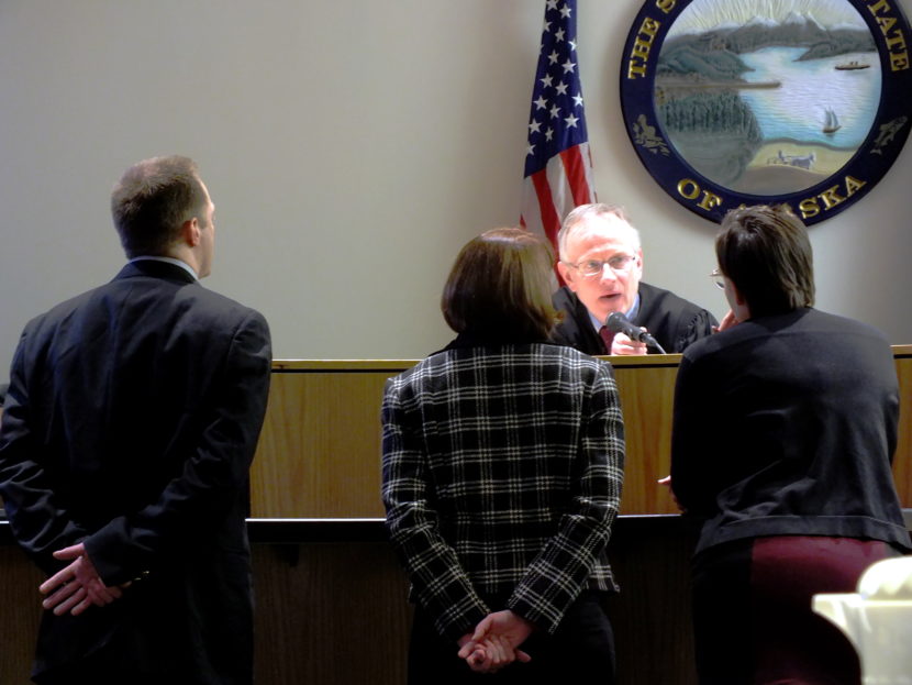 Defendant Christopher Strawn (left), defense atttorney Eve Soutiere (middle), and prosecutor Amy Paige listen to Superior Court Judge Philip Pallenberg during bench conference on Feb. 14, 2017.