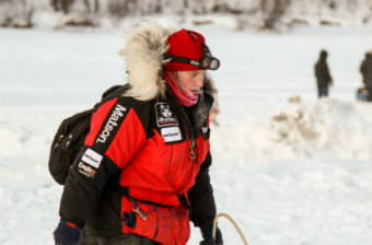 Aliy Zirkle gets water while stopped Thursday, March 9, 2017, at the Nenana checkpoint of the Iditarod. (Photo by Zachariah Hughes/Alaska Public Media)