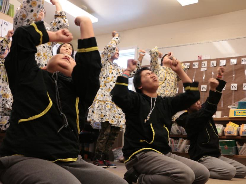 Oscarville students dance in the village school in February 2016.
