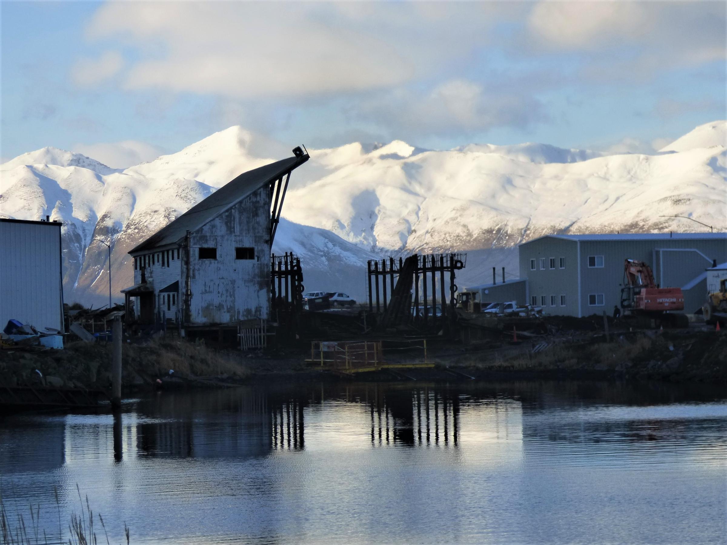 Unalaska’s marine railway stands half-demolished in December. The World War II structure has since been leveled, about 75 years after it was built. (Photo by Laura Kraegel/KUCB)