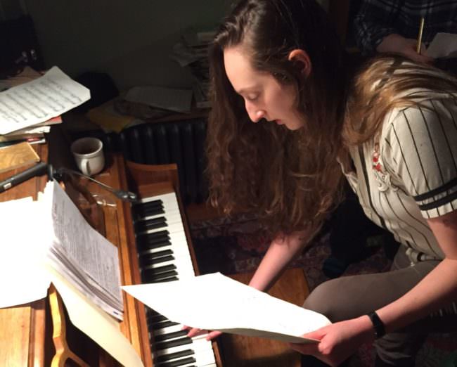 Taylor Vidic rehearses with Queens, an eight-woman vocal ensemble playing the 2017 Alaska Folk Festival. (Photo by Jack Sanders/KTOO)