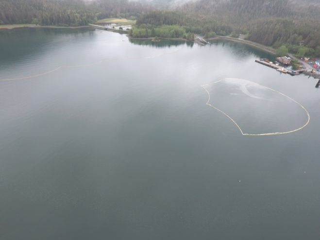 Until the tugboat is salvaged, SEAPRO is maintaining containment boom around the Powhatan and deflection boom off of Starrigavan Beach. (Photo provided by Samson Tug & Barge)