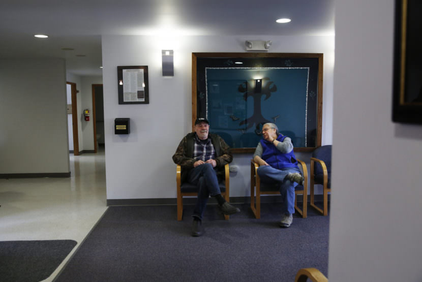 Everett Simons and Lani Hotch chat in the waiting room at the health clinic.