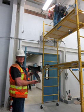 Contractor at work preparing to brace the walls and ceiling joints to earthquake-proof the operations building at Everett's drinking water filtration plant. (Photo by Tom Banse/Northwest News Network)