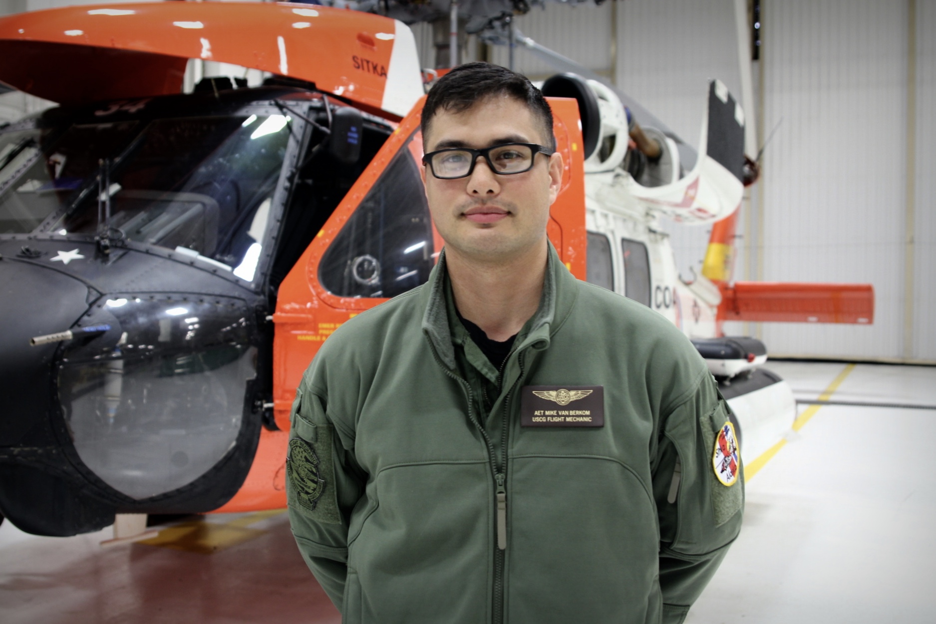 Michael Van Berkom is an avionics electrician. Every couple hundred hours he and a team of Air Station technicians strip the Jayhawks to the bone. (Photo by Emily Russell/KCAW)