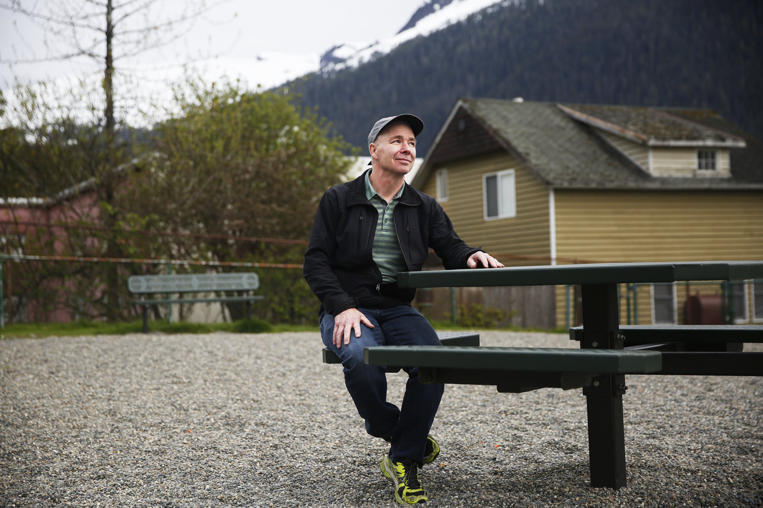 Longtime Ketchikan resident Eric Collins used to work on tugboats, bringing supplies to the logging camps and the Ketchikan pulp mill. Now, he's a cruise ship pilot, steering giant tour vessels into Ketchikan. (Photo by Elissa Nadworny/NPR)