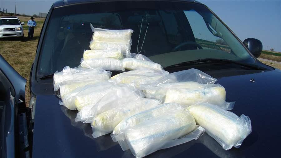 An Oklahoma narcotics agent displays 20 pounds of Mexican crystal meth seized from a drug dealer. As federal, state and local health officials focus on the opioid epidemic, the supply and use of methamphetamine is surging in Oklahoma and other Western, Midwestern and Southern states. (Photo courtesy Oklahoma Bureau of Narcotics)