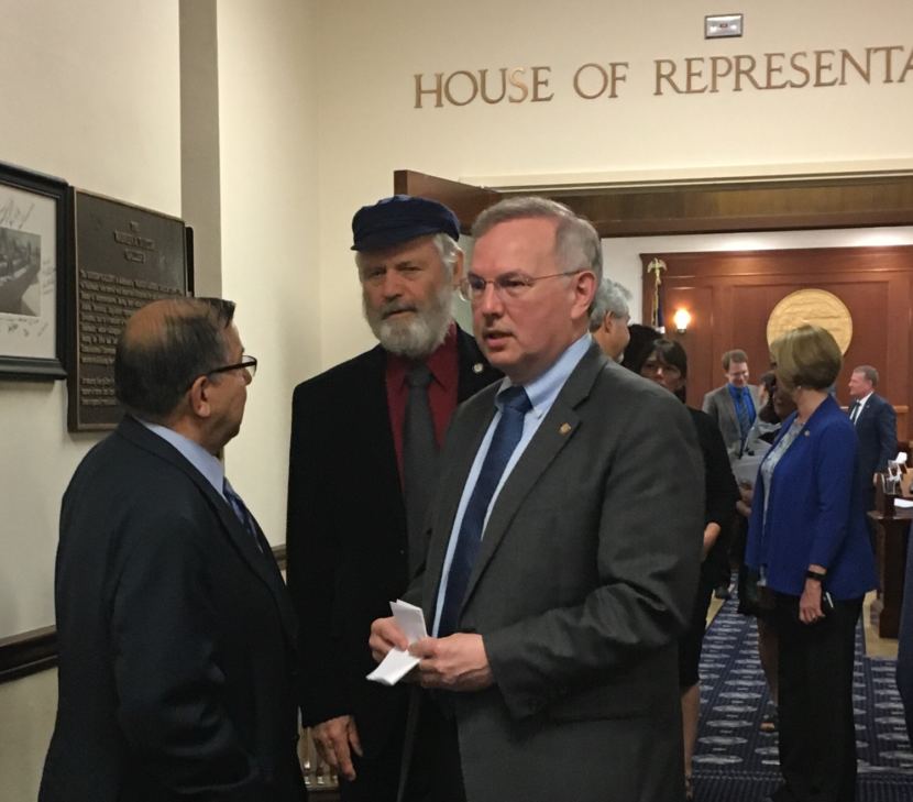 House Speaker Bryce Edgmon, center, was among the lawmakers who gathered after the House passed the operating budget for the fiscal year starting July 1. The move avoided a state government shutdown, but left other major items unresolved, June 23, 2017. (Photo by Andrew Kitchenman/KTOO and Alaska Public Media)